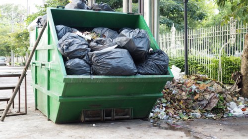 Waste clearance team removing construction materials